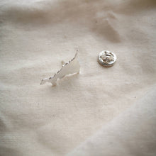 Load image into Gallery viewer, Cornish map silver  pin which brooch back on plain fabric