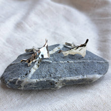 Load image into Gallery viewer, Silver cornish cufflinks, Cornwall map cufflinks on grey and white stone
