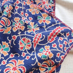 Recycled fabric gift wrap, blue fabric with orange, red, green and white leaf and flower detail