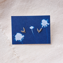 Load image into Gallery viewer, Silver leaf studs on backing card made from indigo blue dandelion cyanotype print