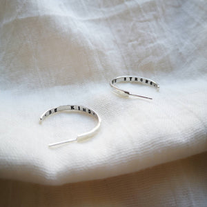 Handmade silver hoops with 'Be kind' 'be strong' messages inside