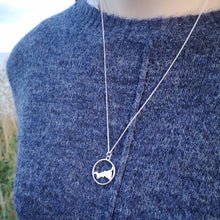 Load image into Gallery viewer, Cornish map necklace worn on blue jumper on Cornish cliffs