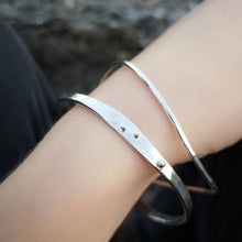 Load image into Gallery viewer, Sustainable recycled silver wave bangles, two bangles worn together on wrist showing silver ball detail