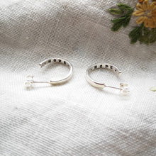 Load image into Gallery viewer, Mini silver hoop earrings with hope message inside, on fabric with embroidered yellow flower