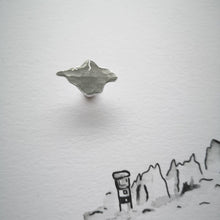 Load image into Gallery viewer, Textured silver Isle of Wight tie pin on black pen sketch of The Needles lighthouse and rocks