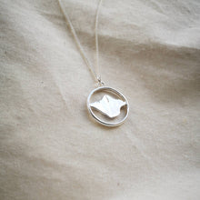 Load image into Gallery viewer, Isle of Wight recycled silver necklace, island map inside silver hoop on calico fabric