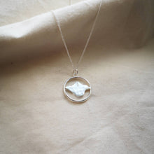 Load image into Gallery viewer, Recycled silver Isle of Wight pendant, textured IOW map shape inside hoop on silver chain, on natural fabric