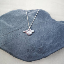 Load image into Gallery viewer, Surf inspired wave design on silver Isle of Wight shaped necklace, displayed on grey stone
