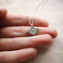 Load image into Gallery viewer, Recycled silver necklace with bursting heart design held on hand