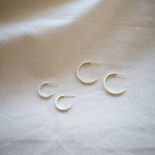 Load image into Gallery viewer, Medium and small set of four silver hoops on plain fabric