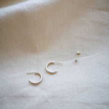 Load image into Gallery viewer, Simple mini silver hoops matte finish side profile with scroll backs