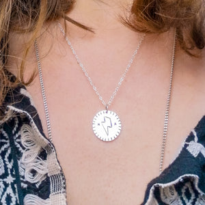 Love token recycled silver necklace with Bowie lightning bolt and initials closeup