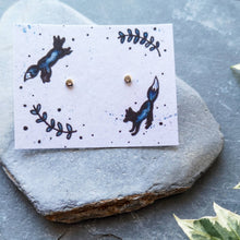 Load image into Gallery viewer, Recycled silver full moon dot studs on recycled cotton backing card with jumping foxes illustration