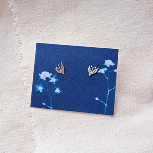 Silver leaf and berry stud earrings on indigo blue forget-me-not cyanotype image backing card 