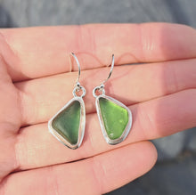 Load and play video in Gallery viewer, Green Sea Glass Drop Earrings with Wave &amp; Star Back Detail
