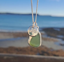 Load and play video in Gallery viewer, Olive Green Sea Glass &amp; Nautical Star Pebble Necklace | Cornish Sea Glass Treasure Necklace
