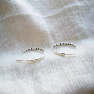 Handmade silver hoop earrings with 'be bold' and 'be brave' messages inside
