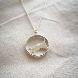 Sustainable recycled silver Cornwall necklace on natural plain calico background