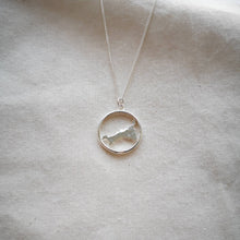 Load image into Gallery viewer, Recycled silver Cornwall necklace inside hoop on natural calico background
