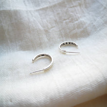 Load image into Gallery viewer, Mini silver hoop earrings with secret heart and love message stamped inside
