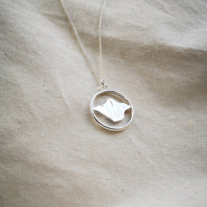 Isle of Wight recycled silver necklace, island map inside silver hoop on calico fabric