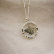 Load image into Gallery viewer, Hammered textured silver isle of wight pendant inside silver hoop close up

