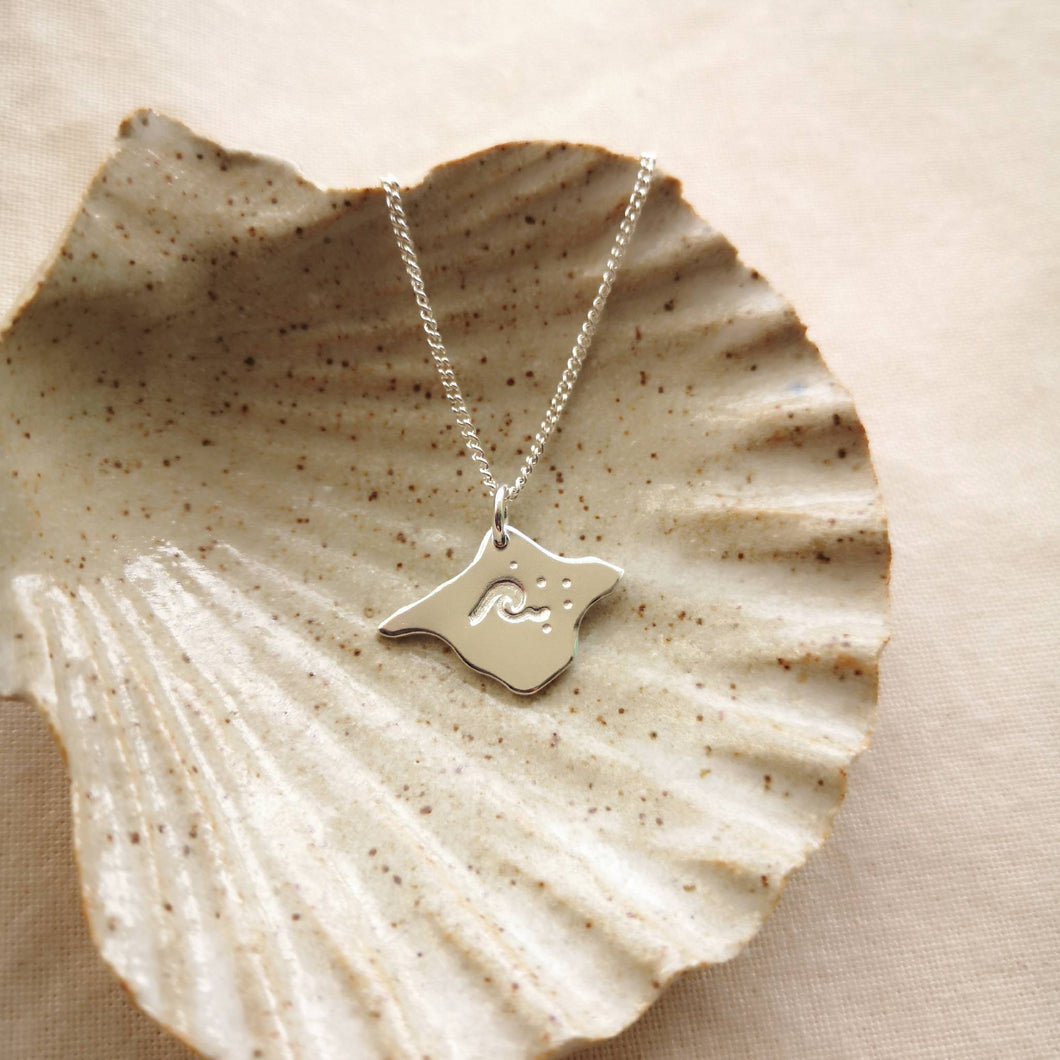 Isle of Wight silver necklace engraved with barrel wave design, inside ceramic shell trinket dish