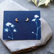 Load image into Gallery viewer, Textured mini moon stud earrings on blue cyanotype forget-me-not eco card 
