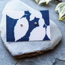 Load image into Gallery viewer, Eco silver tiny moon circle studs on blue leaves cyanotype recycled cotton backing card on slate
