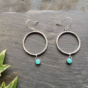 Boho silver hoop earrings with aqua blue stone on slate with ivy