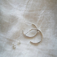 Load image into Gallery viewer, Side profile of handmade recycled silver hoop earrings with scroll backs
